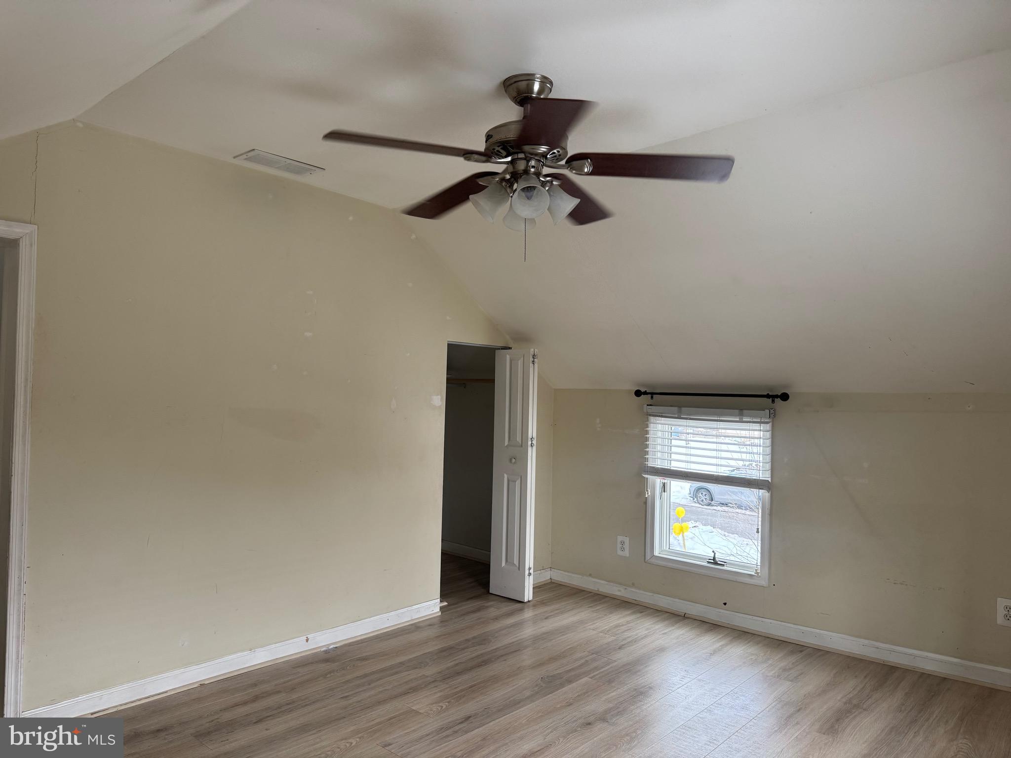 3849 Church Road Mount Laurel, NJ 08054 - Photo 14 of 19 an empty room with a window and a ceiling fan