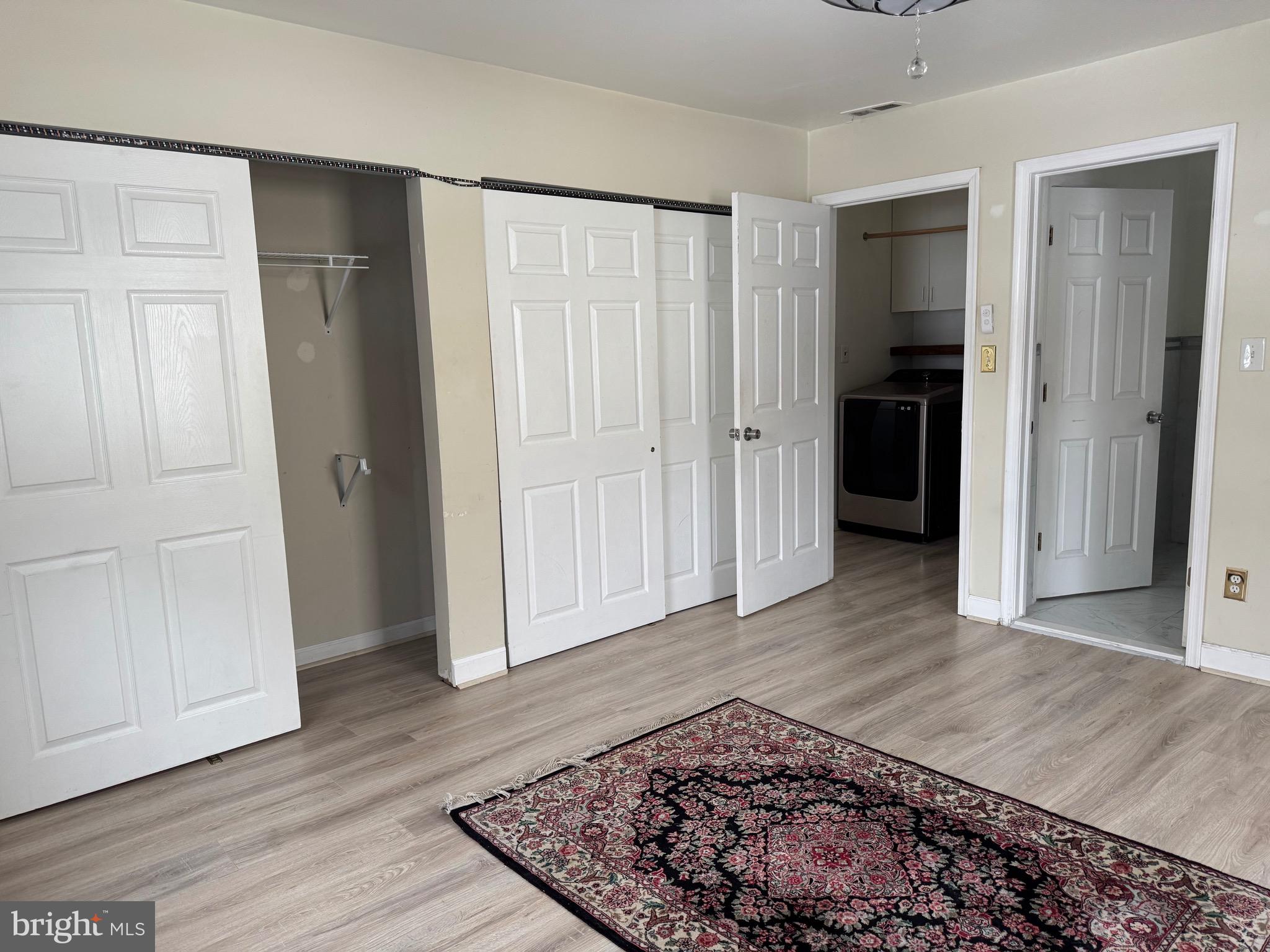 3849 Church Road Mount Laurel, NJ 08054 - Photo 16 of 19 an entryway space with wooden floor & bathroom