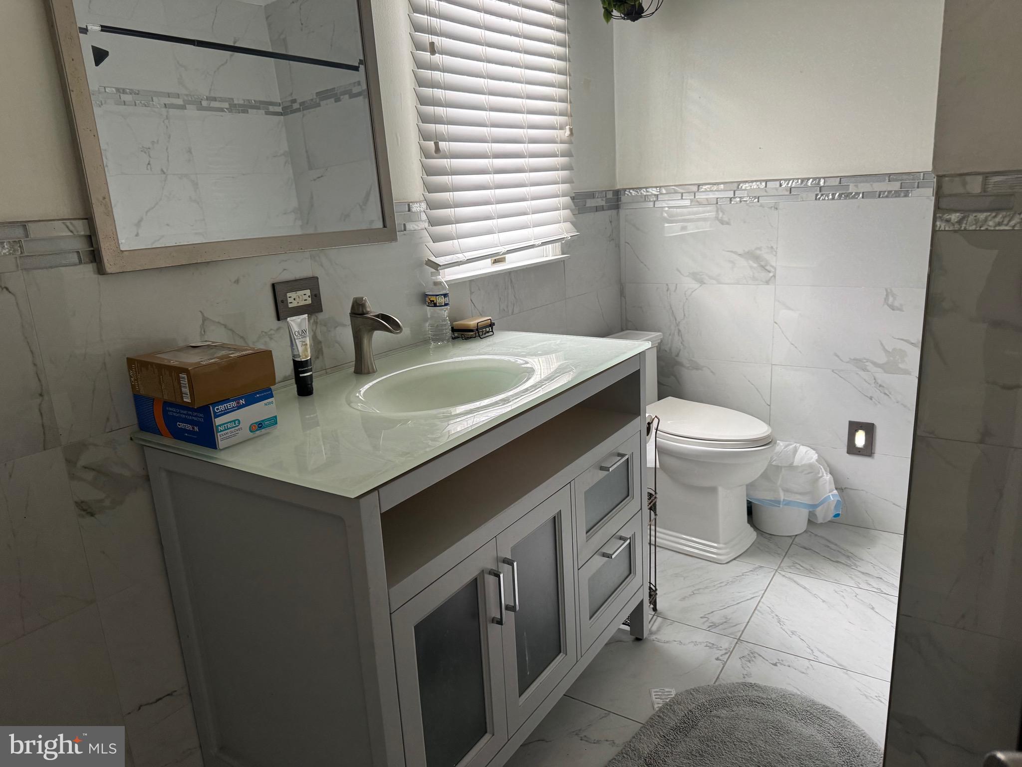 3849 Church Road Mount Laurel, NJ 08054 - Photo 18 of 19 a bathroom with a sink a toilet and shower curtain