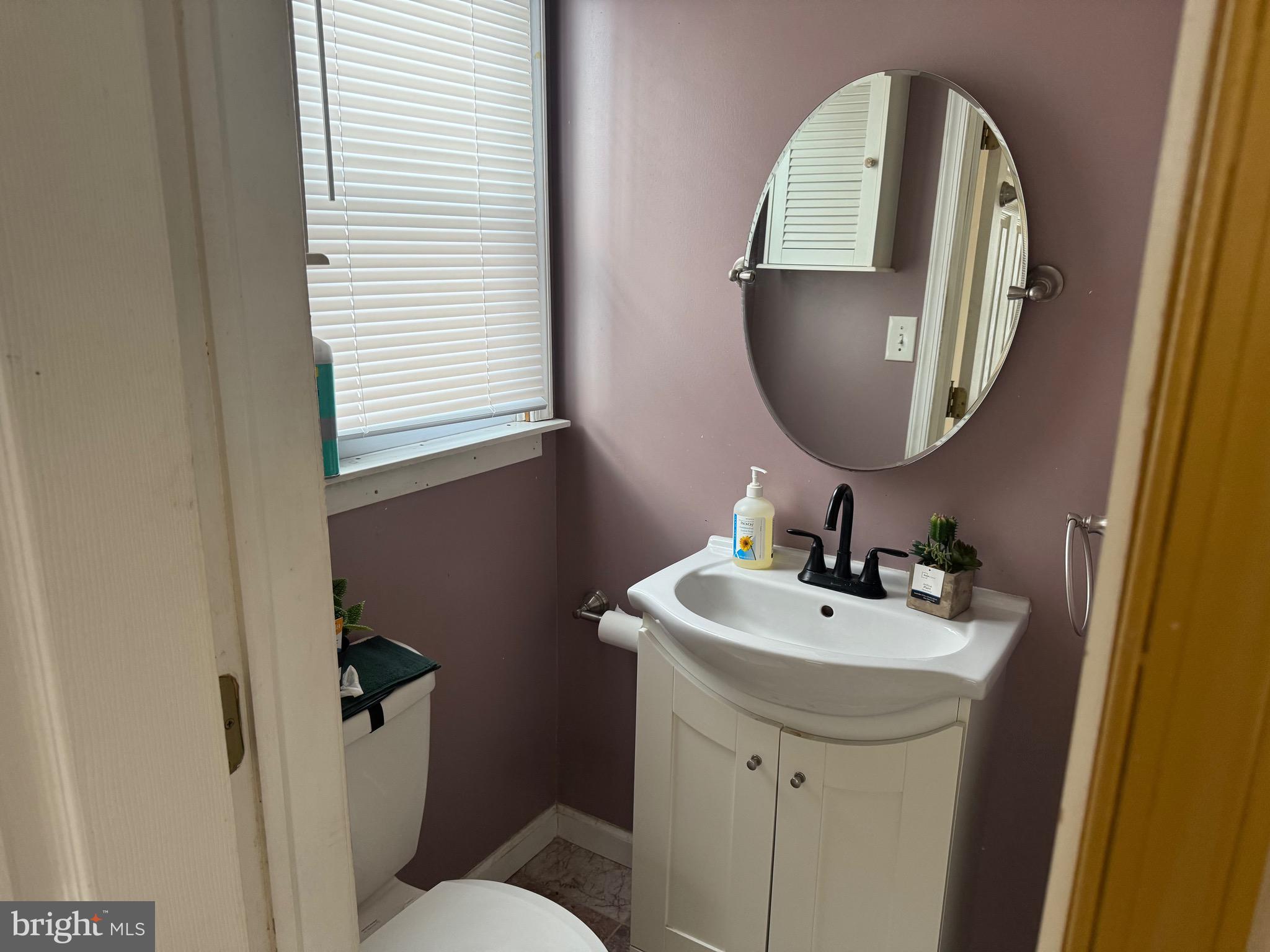 3849 Church Road Mount Laurel, NJ 08054 - Photo 6 of 19 a bathroom with a toilet sink and mirror