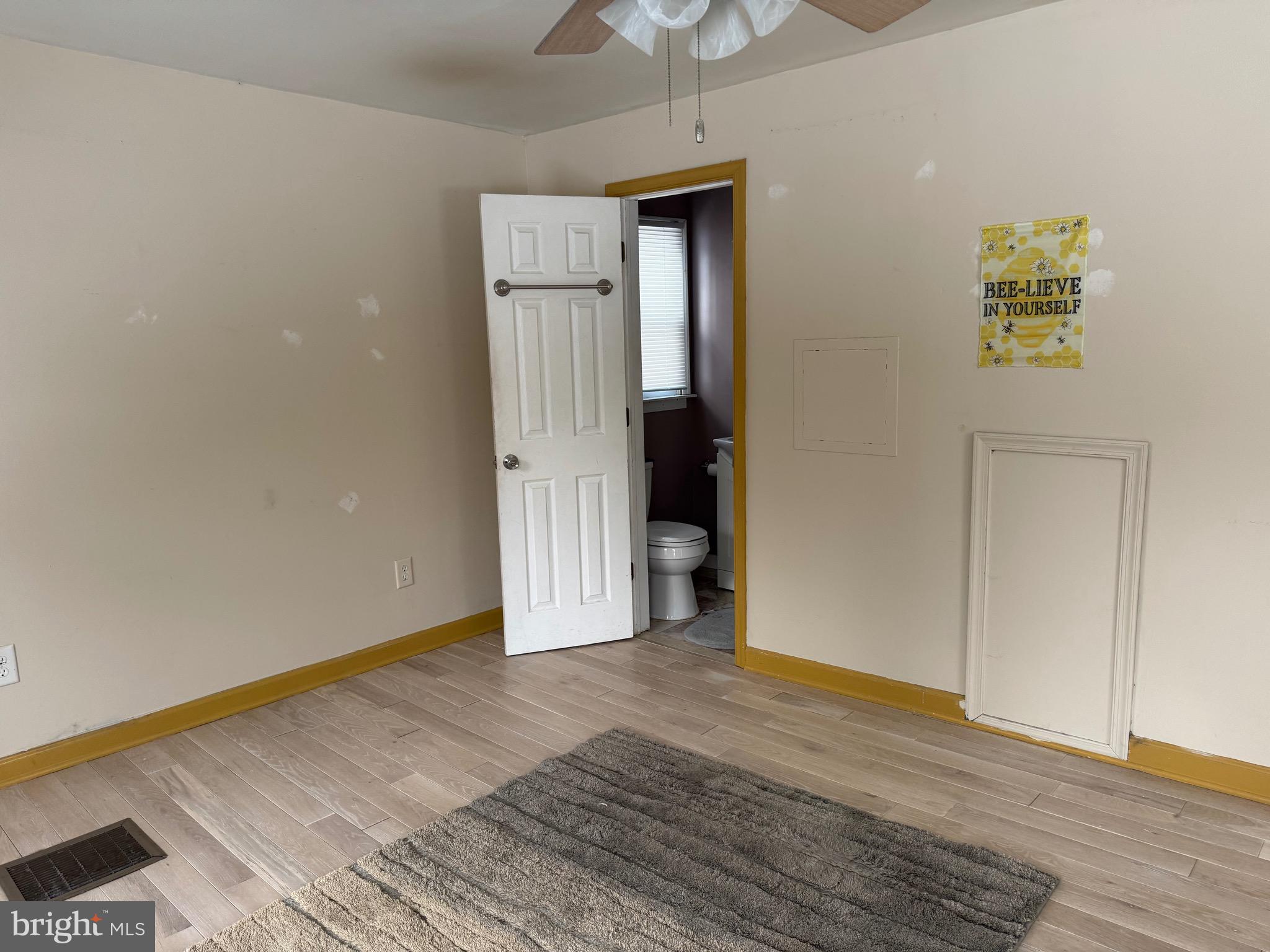 3849 Church Road Mount Laurel, NJ 08054 - Photo 10 of 19 a view of an empty room with wooden floor and a window