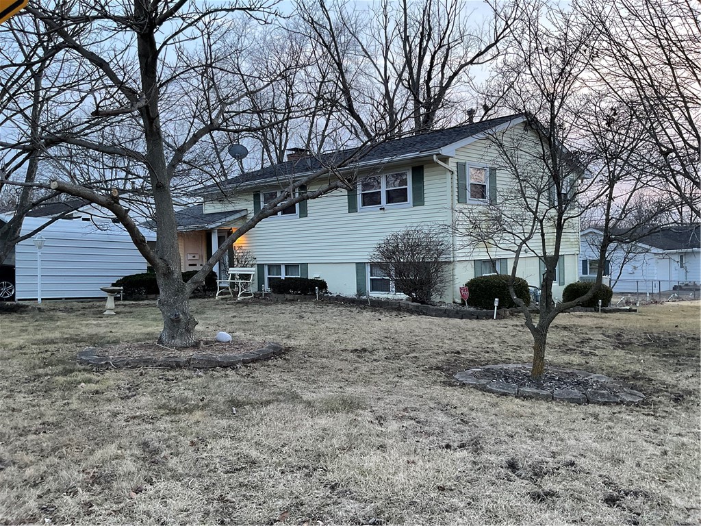 993 Linden Avenue Decatur, IL 62522 - Photo 2 of 7 a view of a house with a yard and a tree