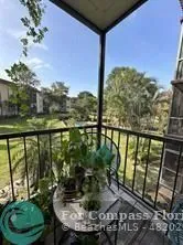 a view of a balcony with lake view and mountain view