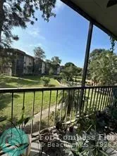 a view of a balcony with lake view and mountain view