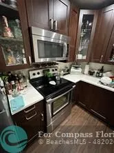 a kitchen with a stove and a microwave