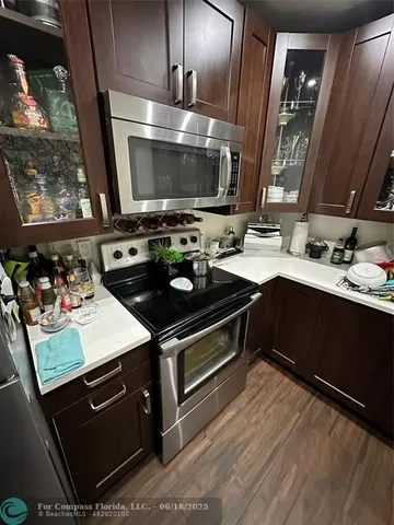 a kitchen with a stove and a microwave