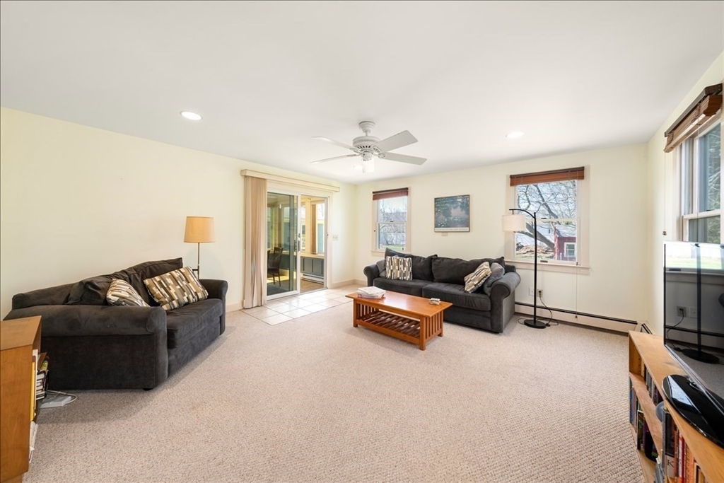 10 2nd Street Natick, MA 01760 - Photo 12 of 31 a living room with furniture a ceiling fan and a window