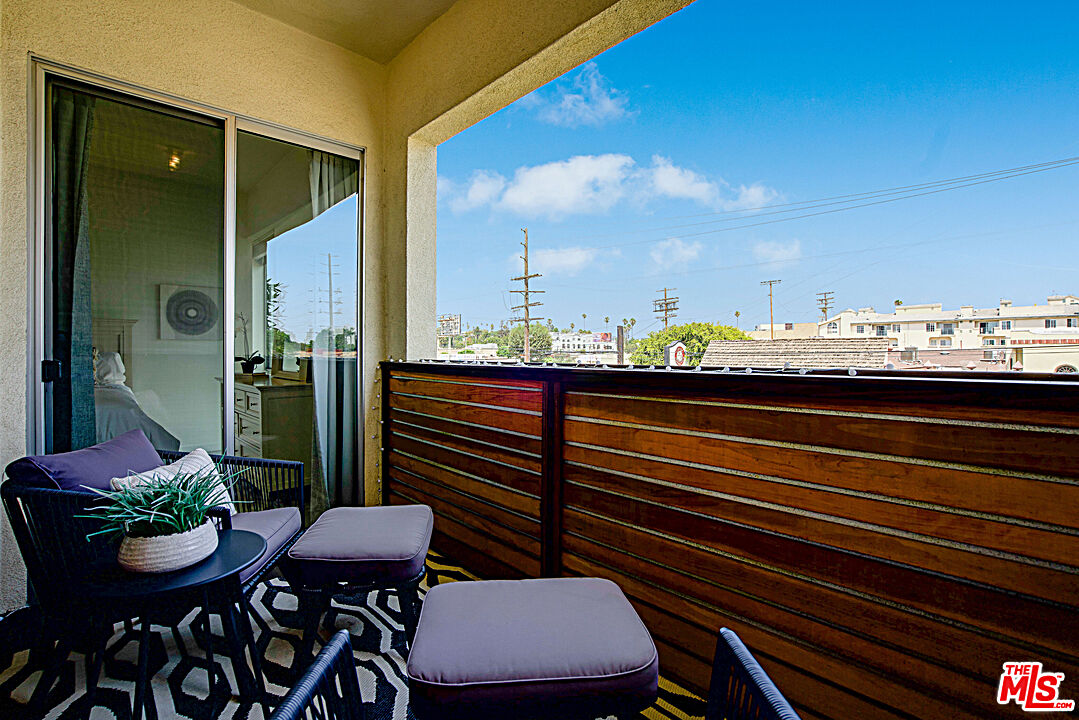12411 Pacific Avenue, Unit 205 Los Angeles, CA 90066 - Photo 4 of 21 a view of a chairs and table in the balcony