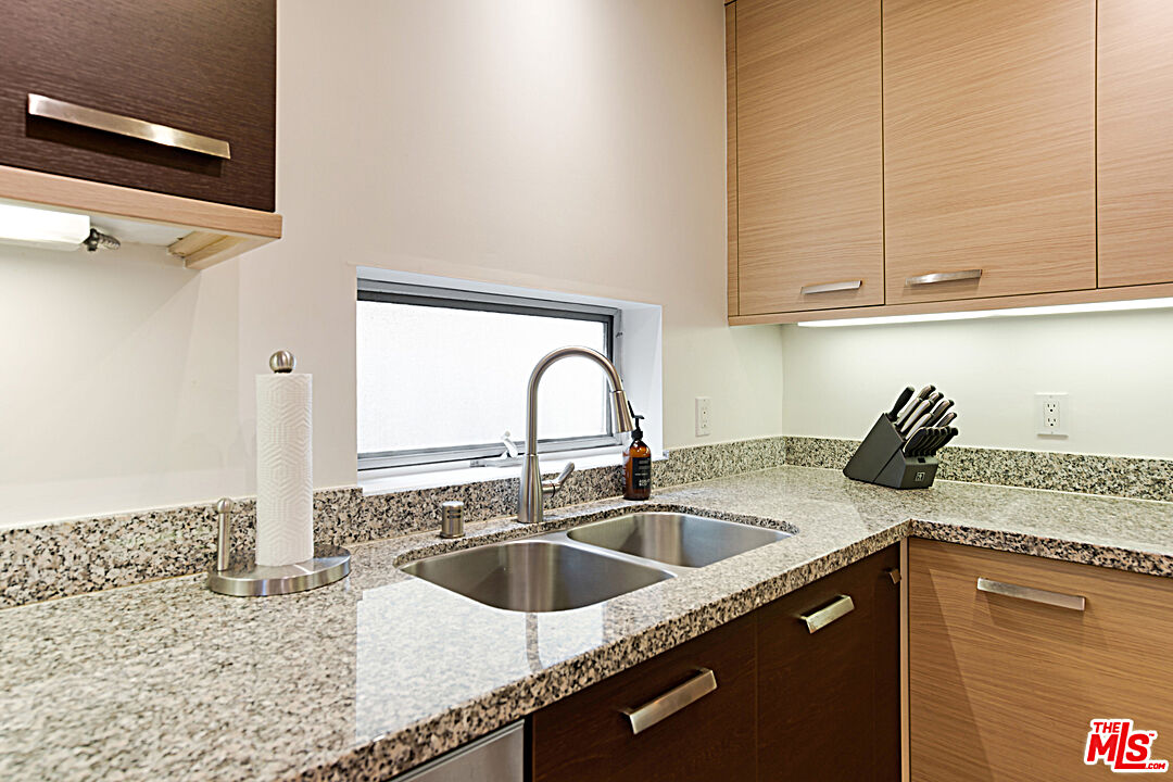 12411 Pacific Avenue, Unit 205 Los Angeles, CA 90066 - Photo 7 of 21 a kitchen with a sink and cabinets