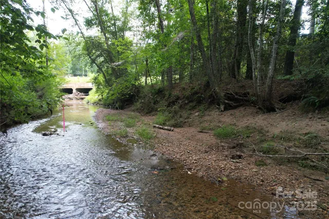 a view of a pathway with a yard