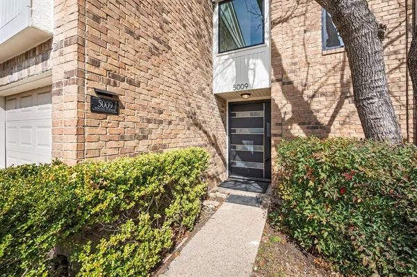 a brick building with a yard