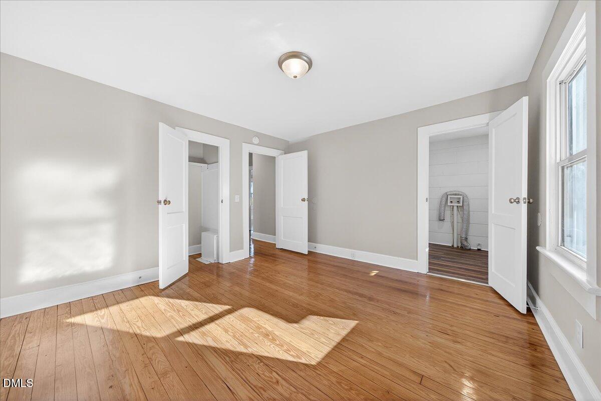 23 West Academy Street Wendell, NC 27591 - Photo 17 of 31 a view of a livingroom with wooden floor and staircase