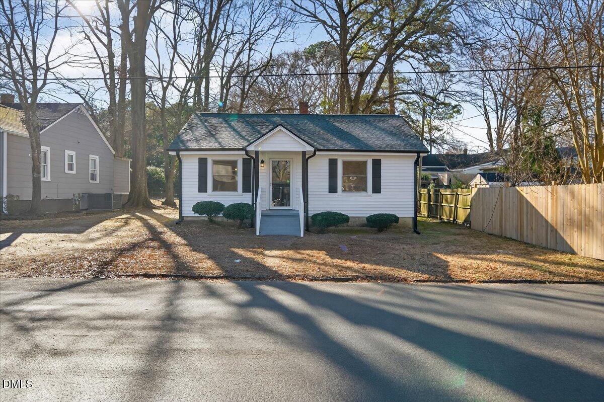 23 West Academy Street Wendell, NC 27591 - Photo 2 of 31 a view of a large house with a yard and large tree