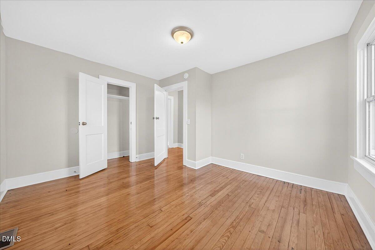 23 West Academy Street Wendell, NC 27591 - Photo 23 of 31 a view of an empty room with wooden floor