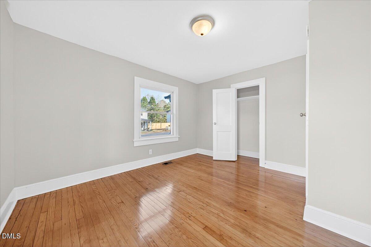 23 West Academy Street Wendell, NC 27591 - Photo 24 of 31 an empty room with windows and closet