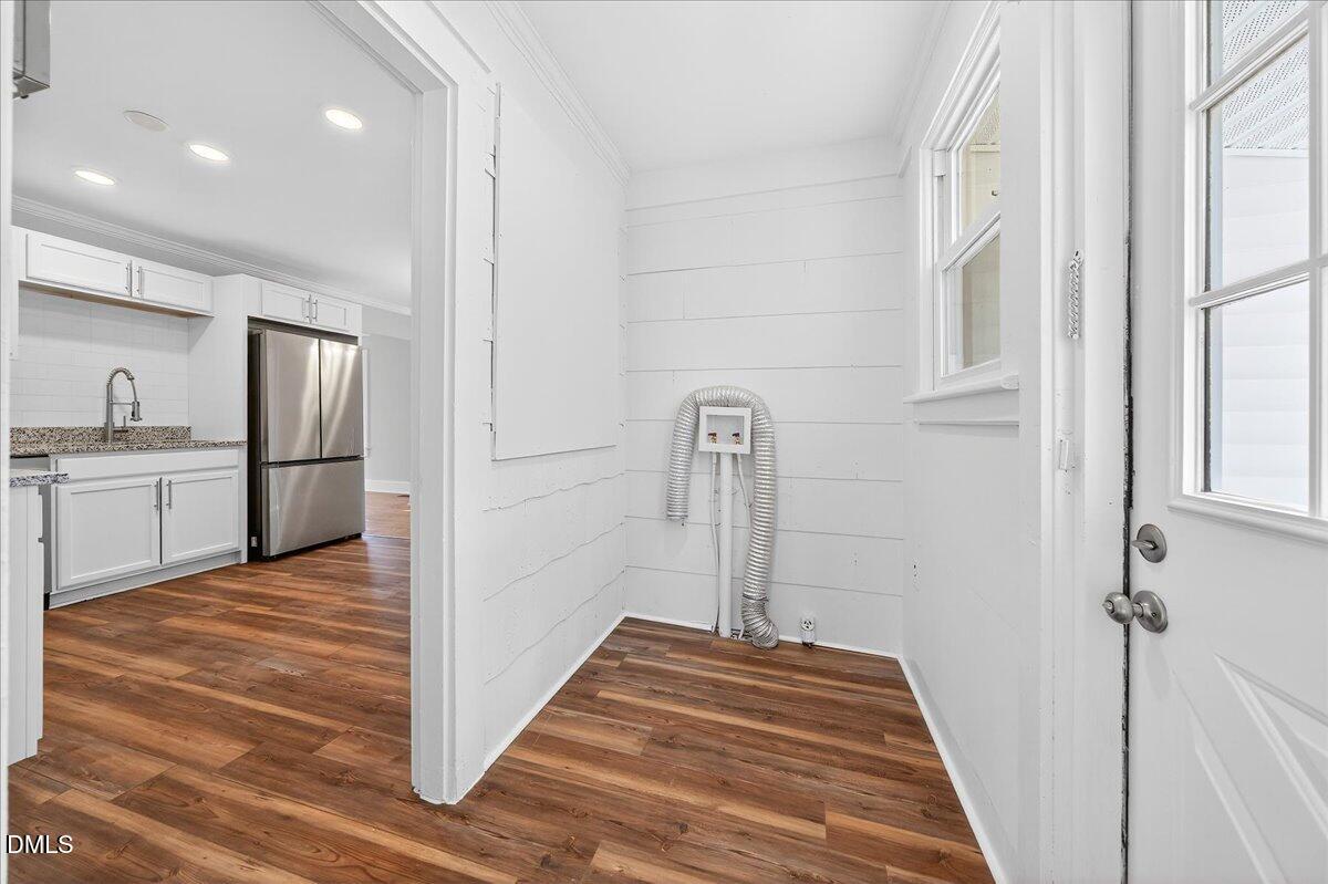 23 West Academy Street Wendell, NC 27591 - Photo 25 of 31 a view of a kitchen from the hallway