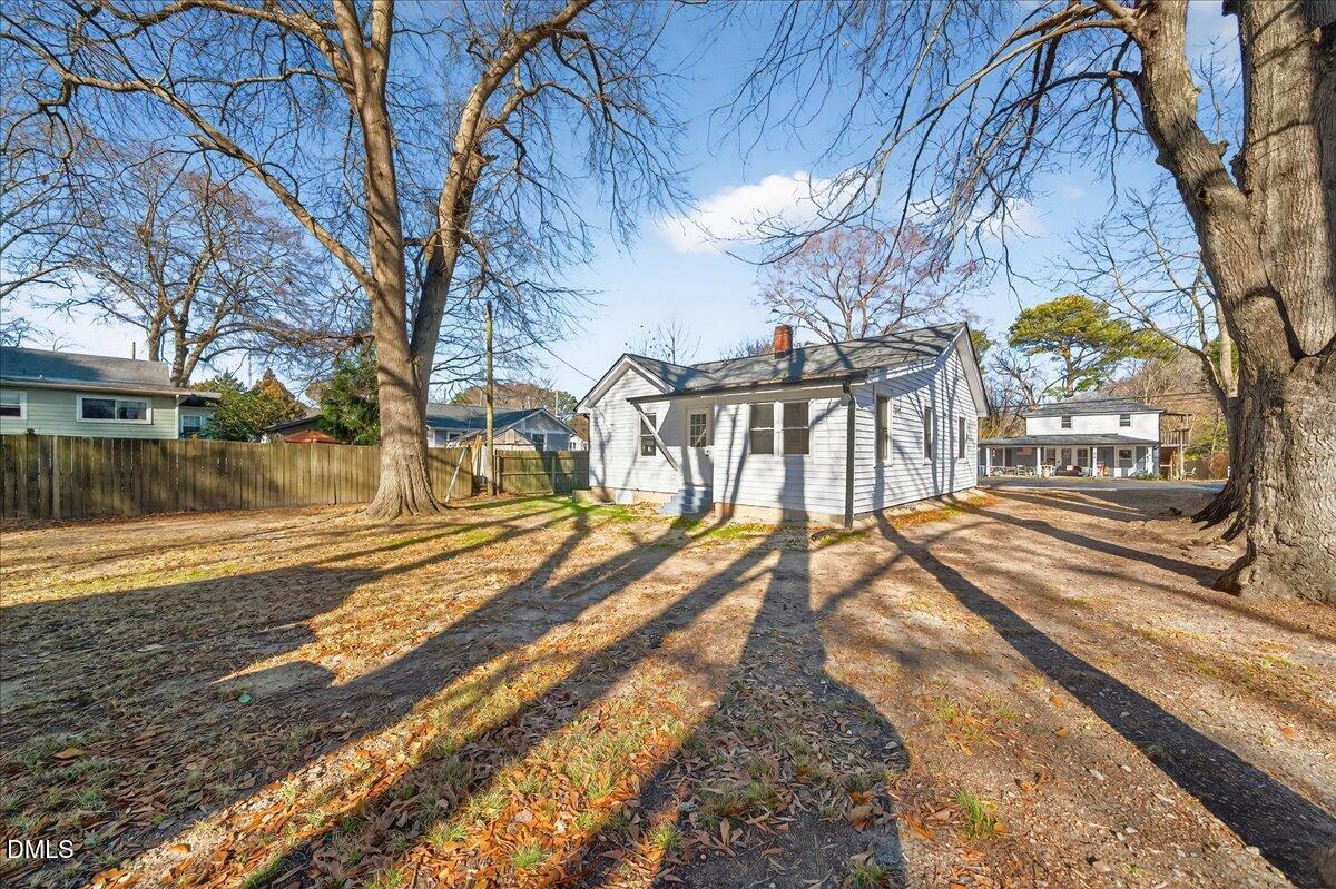 23 West Academy Street Wendell, NC 27591 - Photo 26 of 31 a view of a yard with trees