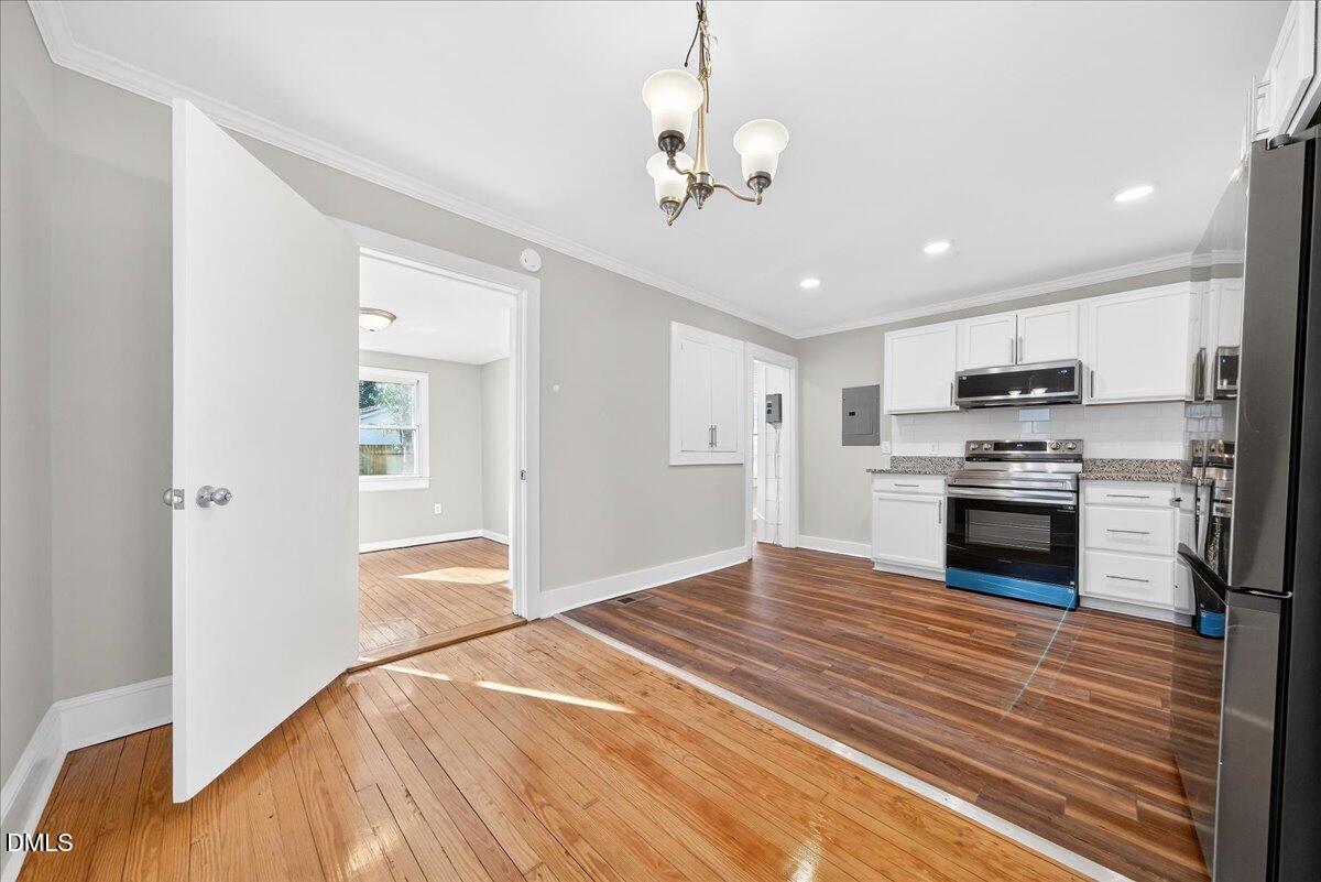 23 West Academy Street Wendell, NC 27591 - Photo 8 of 31 a view of kitchen with sink and microwave