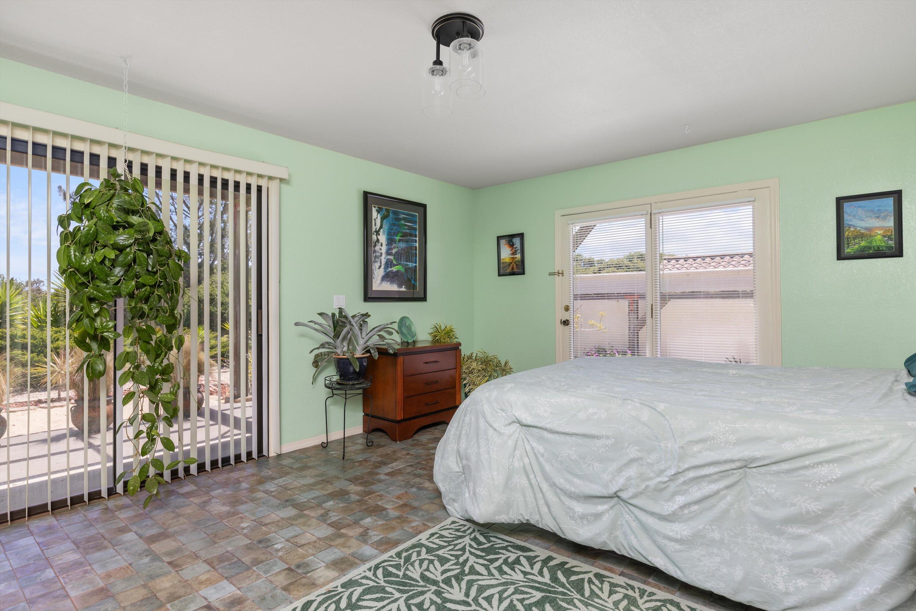 3194 Manley Drive Lompoc, CA 93436 - Photo 14 of 43 a bedroom with a bed and a chandelier