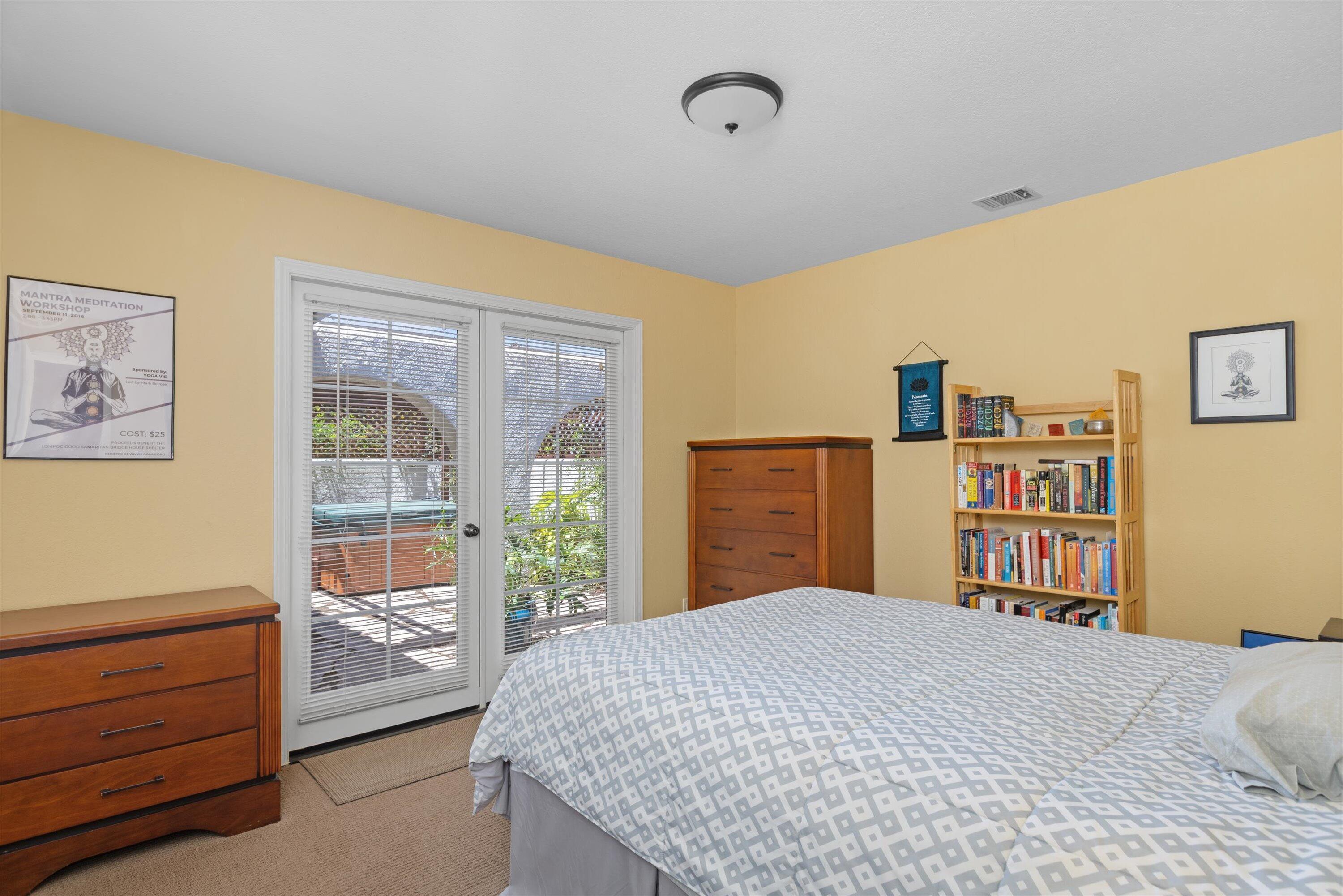3194 Manley Drive Lompoc, CA 93436 - Photo 17 of 43 a bedroom with a large bed and a window
