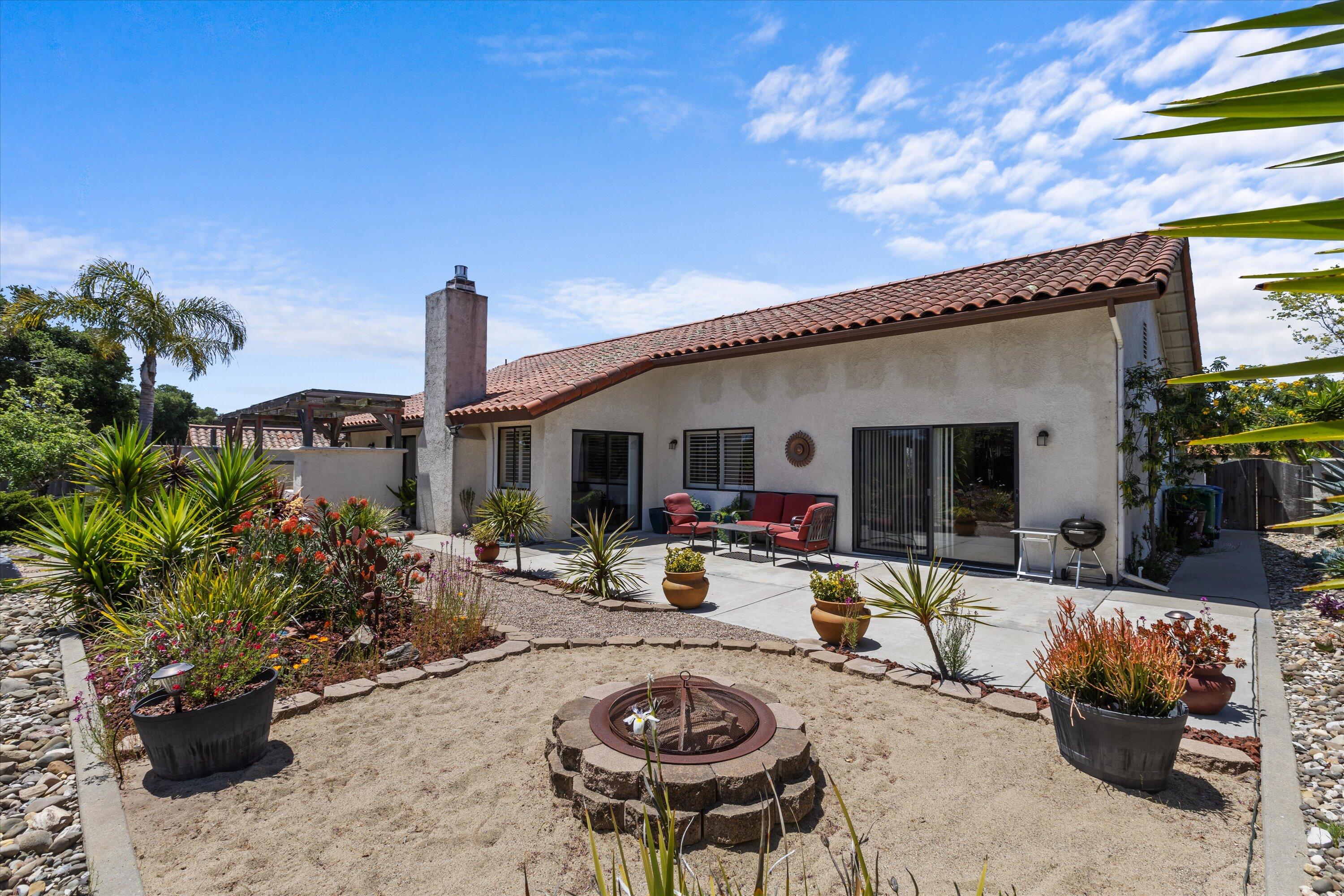 3194 Manley Drive Lompoc, CA 93436 - Photo 31 of 43 a view of a backyard with plants and a patio