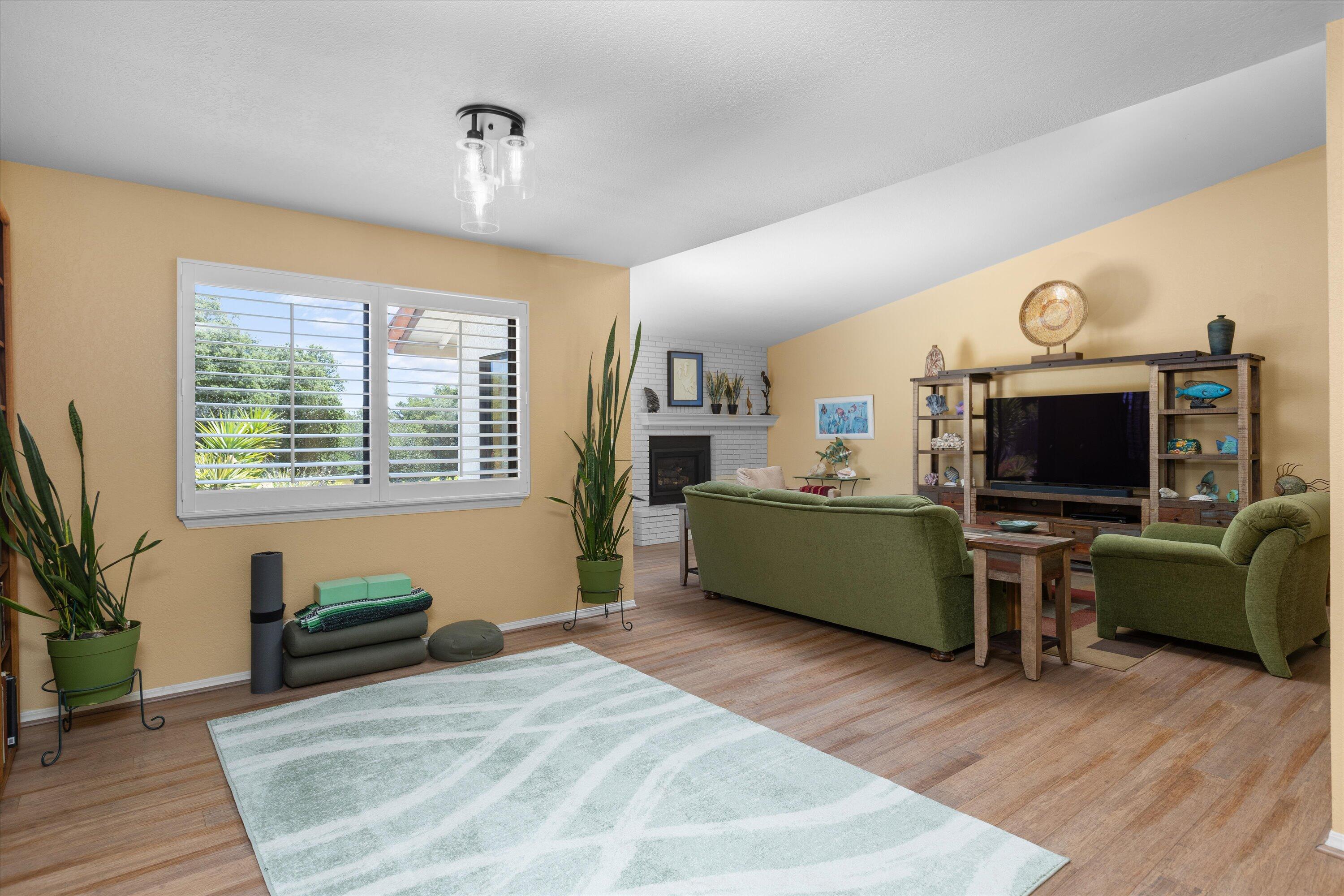 3194 Manley Drive Lompoc, CA 93436 - Photo 5 of 43 a living room with furniture a flat screen tv and a wooden floor