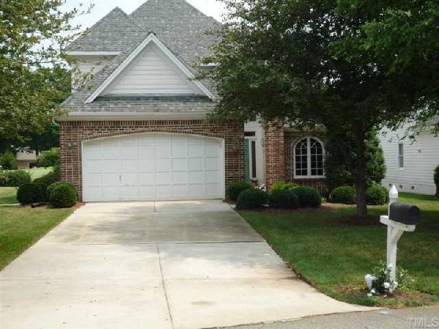 2908 Hawtree Drive Raleigh, NC 27613 - Photo 1 of 12 a front view of a house with a yard and garage