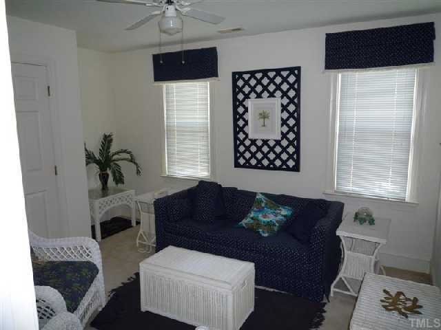 2908 Hawtree Drive Raleigh, NC 27613 - Photo 8 of 12 a living room with furniture and a fireplace