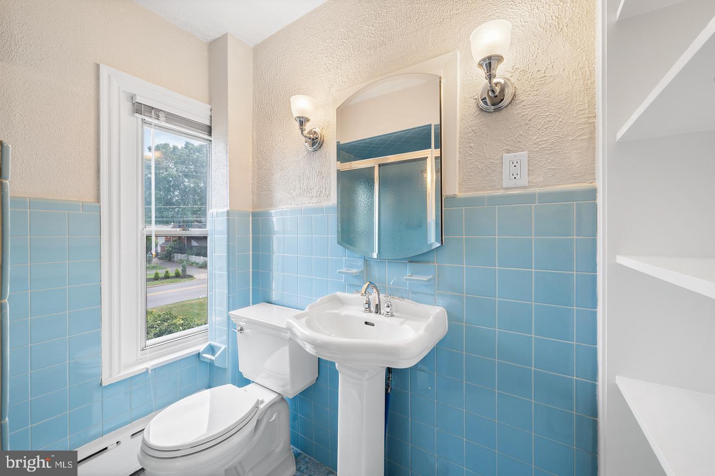 322 Conshohocken State Road Gladwyne, PA 19035 - Photo 26 of 31 a bathroom with a sink toilet and mirror