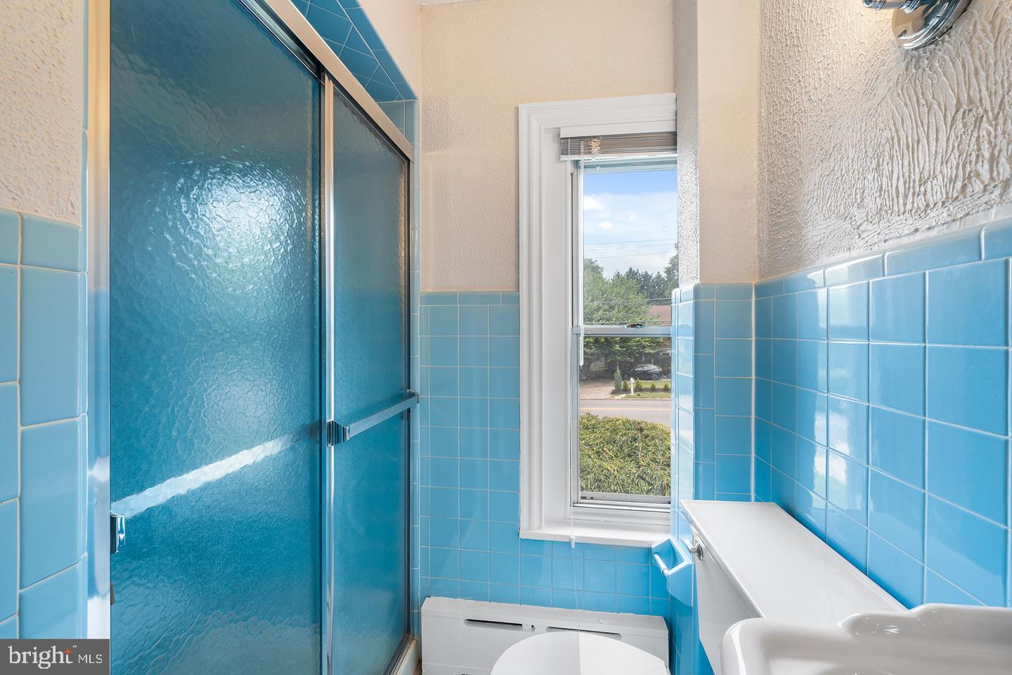 322 Conshohocken State Road Gladwyne, PA 19035 - Photo 27 of 31 a bathroom with a toilet tub and shower