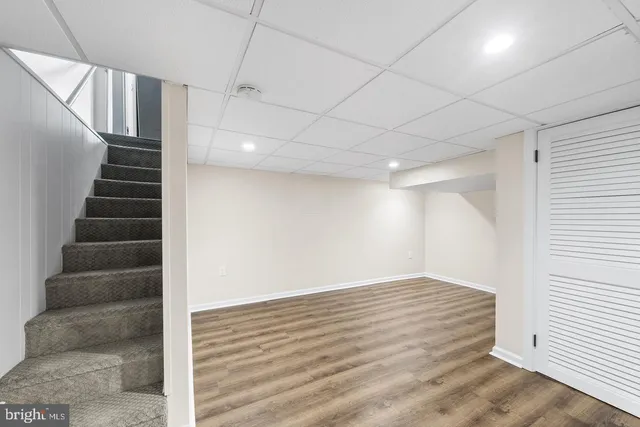 a bathroom with a sink a toilet a mirror and vanity