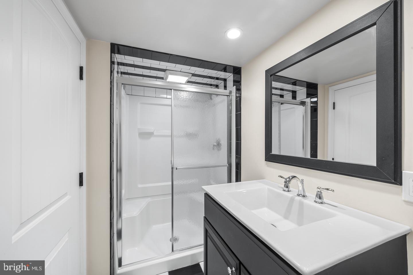 322 Conshohocken State Road Gladwyne, PA 19035 - Photo 31 of 31 a bathroom with a sink mirror and shower