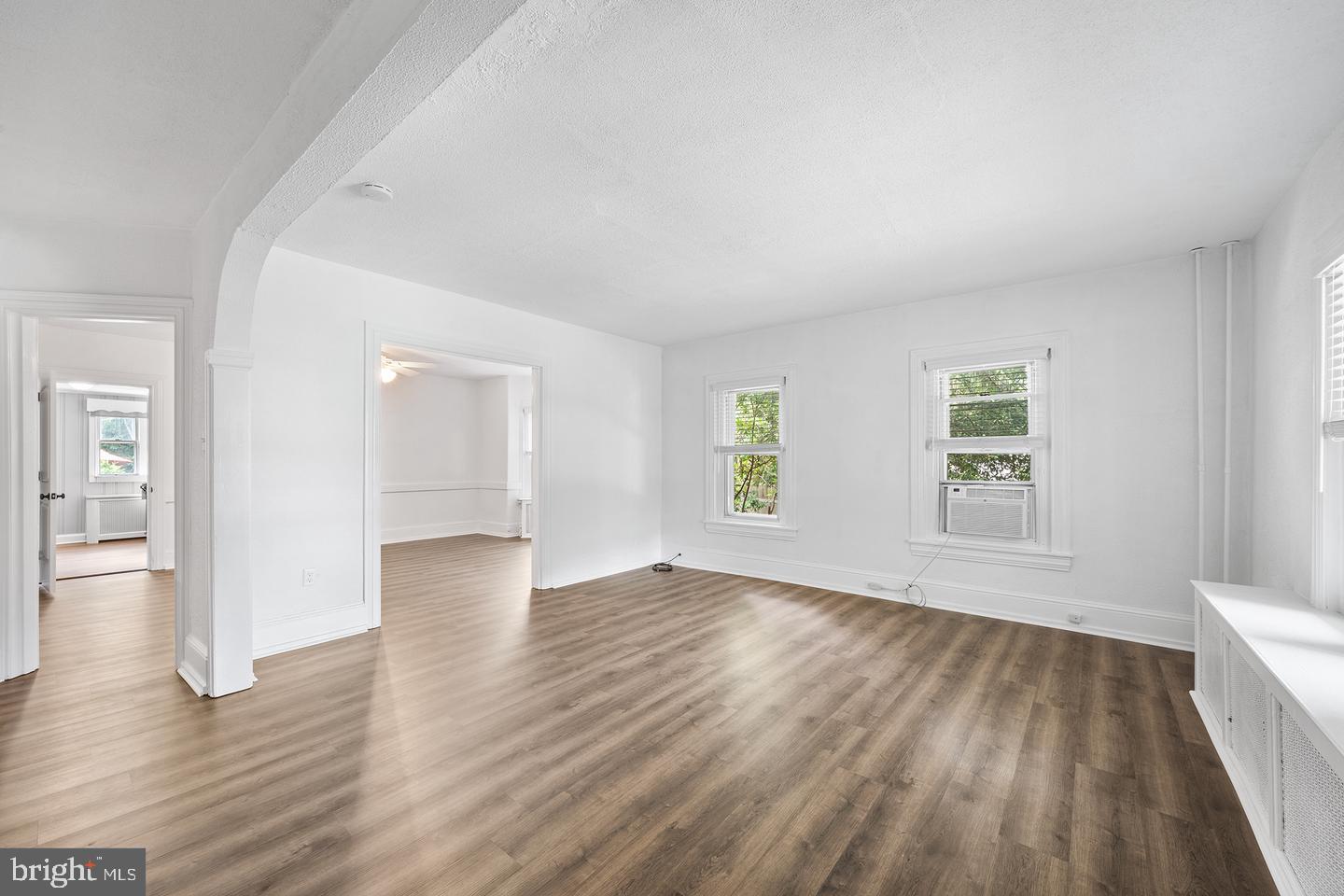 322 Conshohocken State Road Gladwyne, PA 19035 - Photo 10 of 31 an empty room with wooden floor and windows