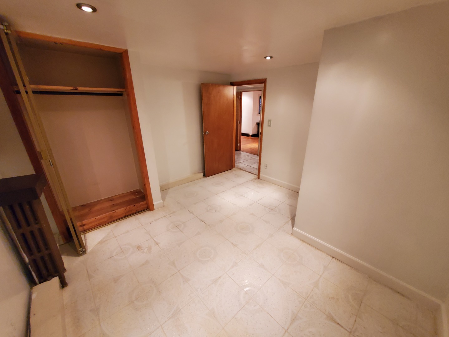 5135 West Roscoe Street, Unit B Chicago, IL 60641 - Photo 11 of 12 an empty room with windows