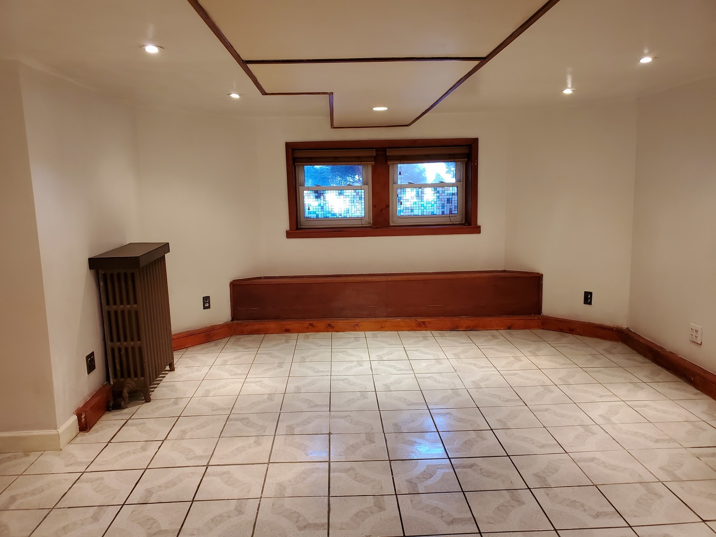 5135 West Roscoe Street, Unit B Chicago, IL 60641 - Photo 8 of 12 a view of an empty room with wooden floor and a window