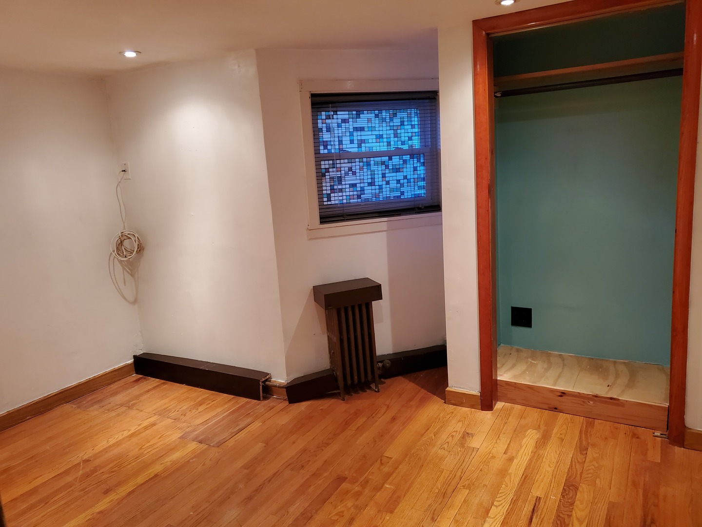 5135 West Roscoe Street, Unit B Chicago, IL 60641 - Photo 10 of 12 a view of an empty room with closet and a window