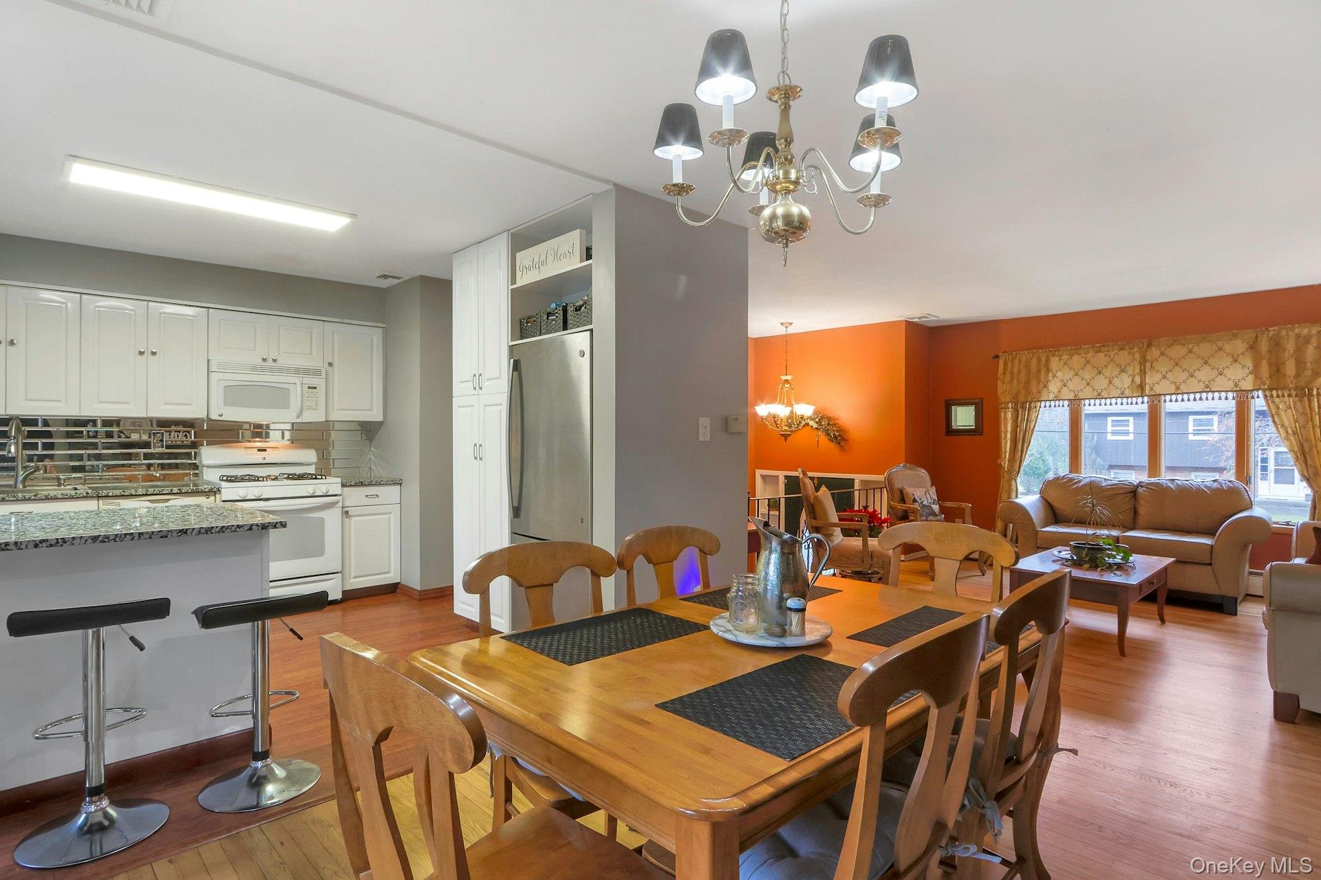 21 Mill Creek Road New City, NY 10956 - Photo 8 of 50 a view of a dining room with furniture a chandelier and wooden floor