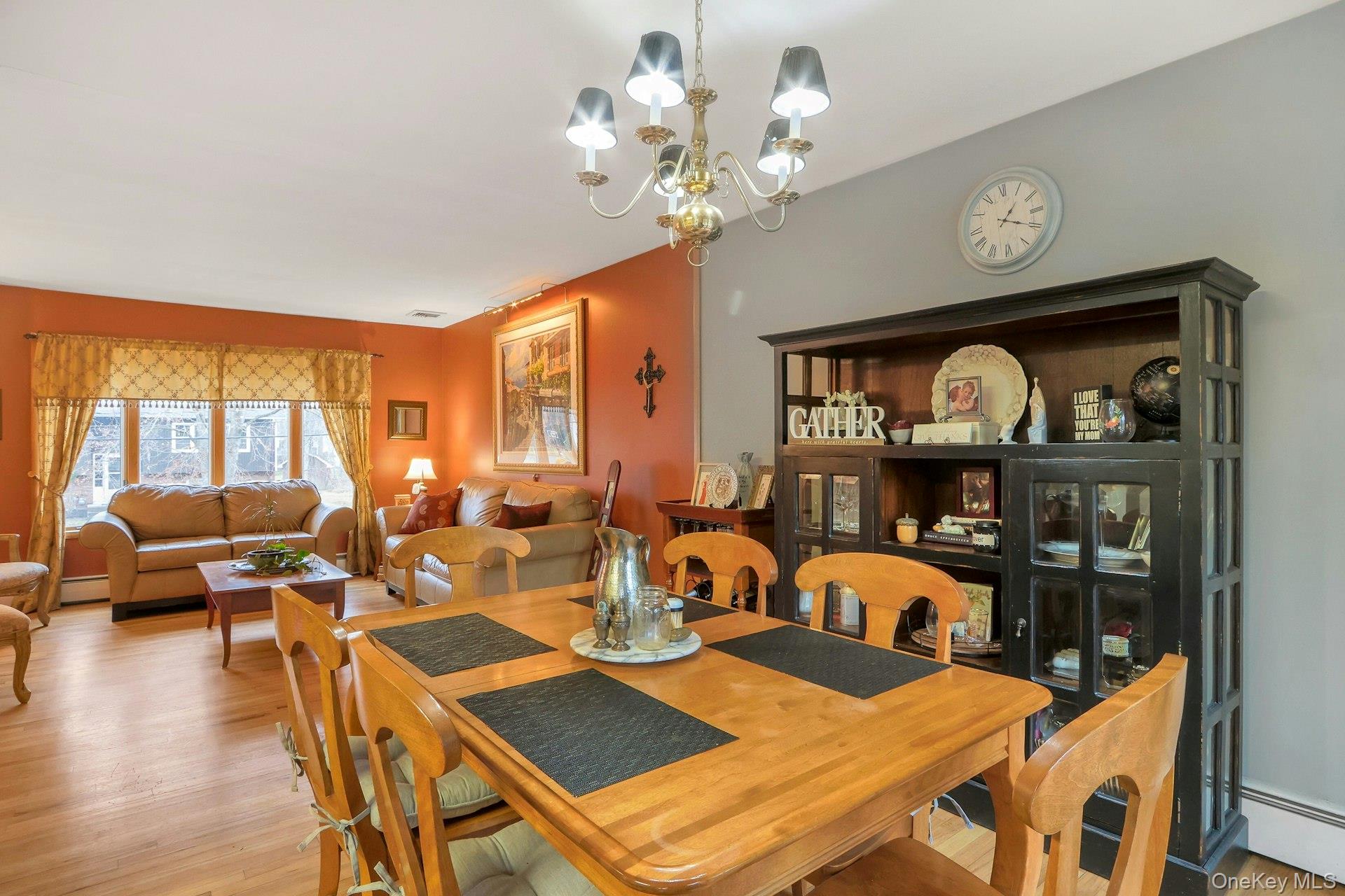 21 Mill Creek Road New City, NY 10956 - Photo 10 of 50 a view of a dining room with furniture a chandelier and wooden floor
