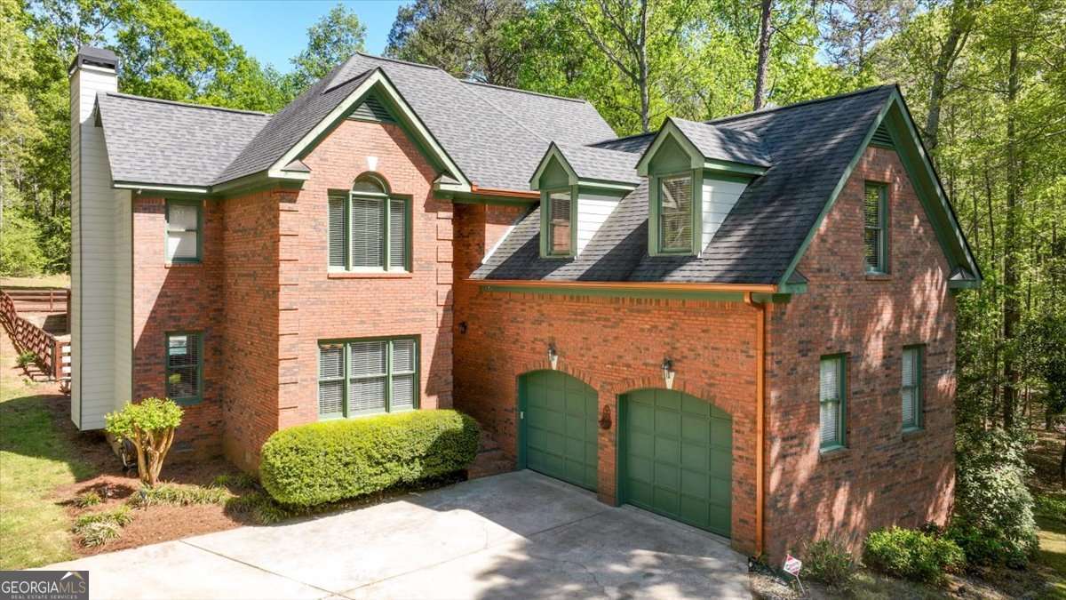 71 Staghorn Trail Nicholson, GA 30565 - Photo 1 of 32 a front view of a house with garden