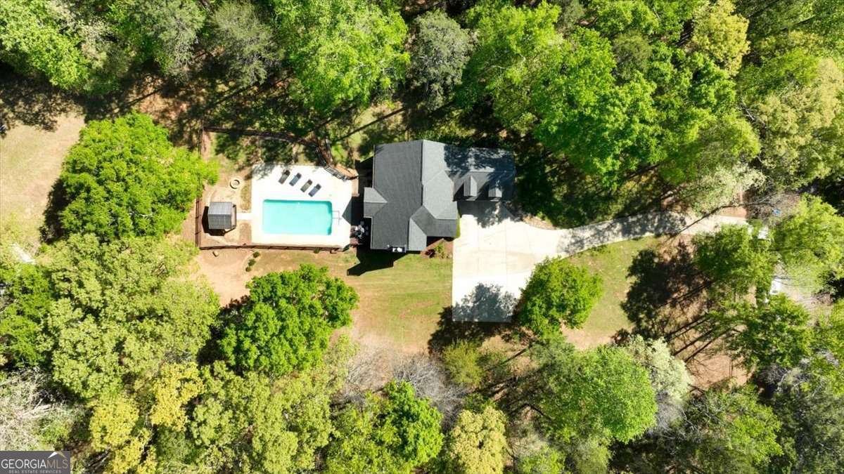 71 Staghorn Trail Nicholson, GA 30565 - Photo 25 of 32 a view of a yard with plants and large trees