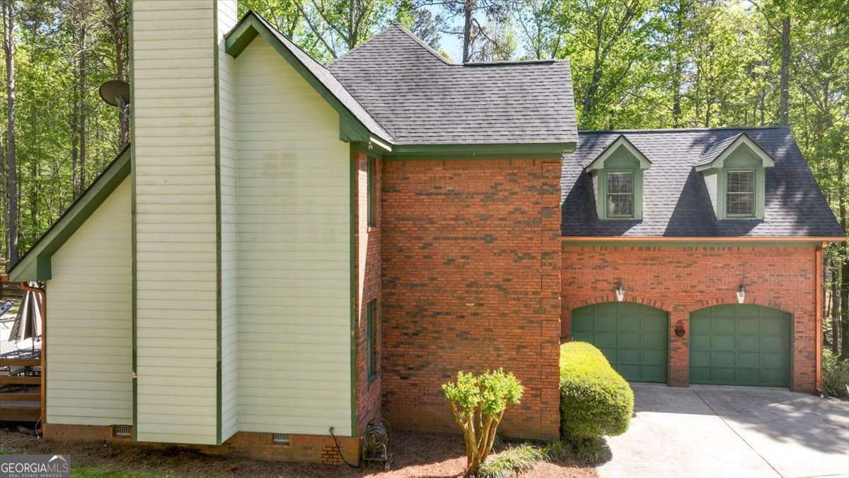 71 Staghorn Trail Nicholson, GA 30565 - Photo 3 of 32 a front view of a house with garden