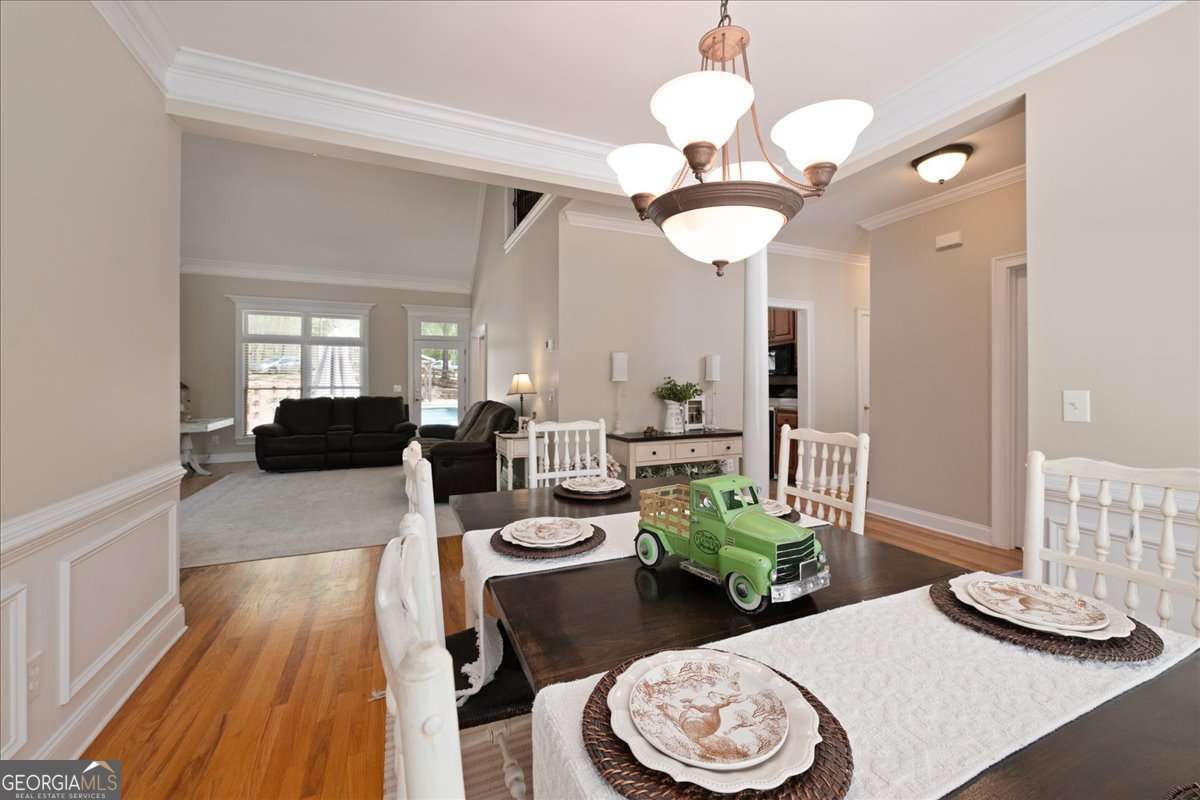 71 Staghorn Trail Nicholson, GA 30565 - Photo 5 of 32 a view of a dining room with furniture and wooden floor