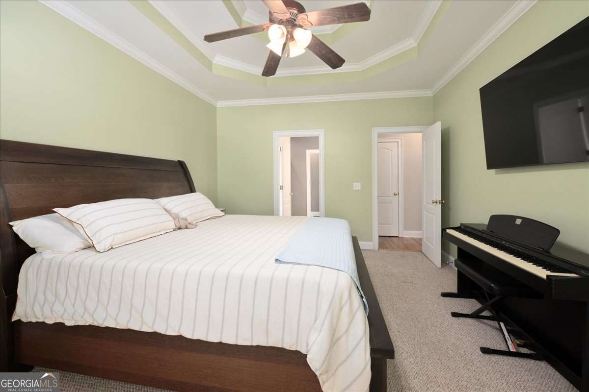 71 Staghorn Trail Nicholson, GA 30565 - Photo 10 of 32 a bedroom with a bed and a flat screen tv
