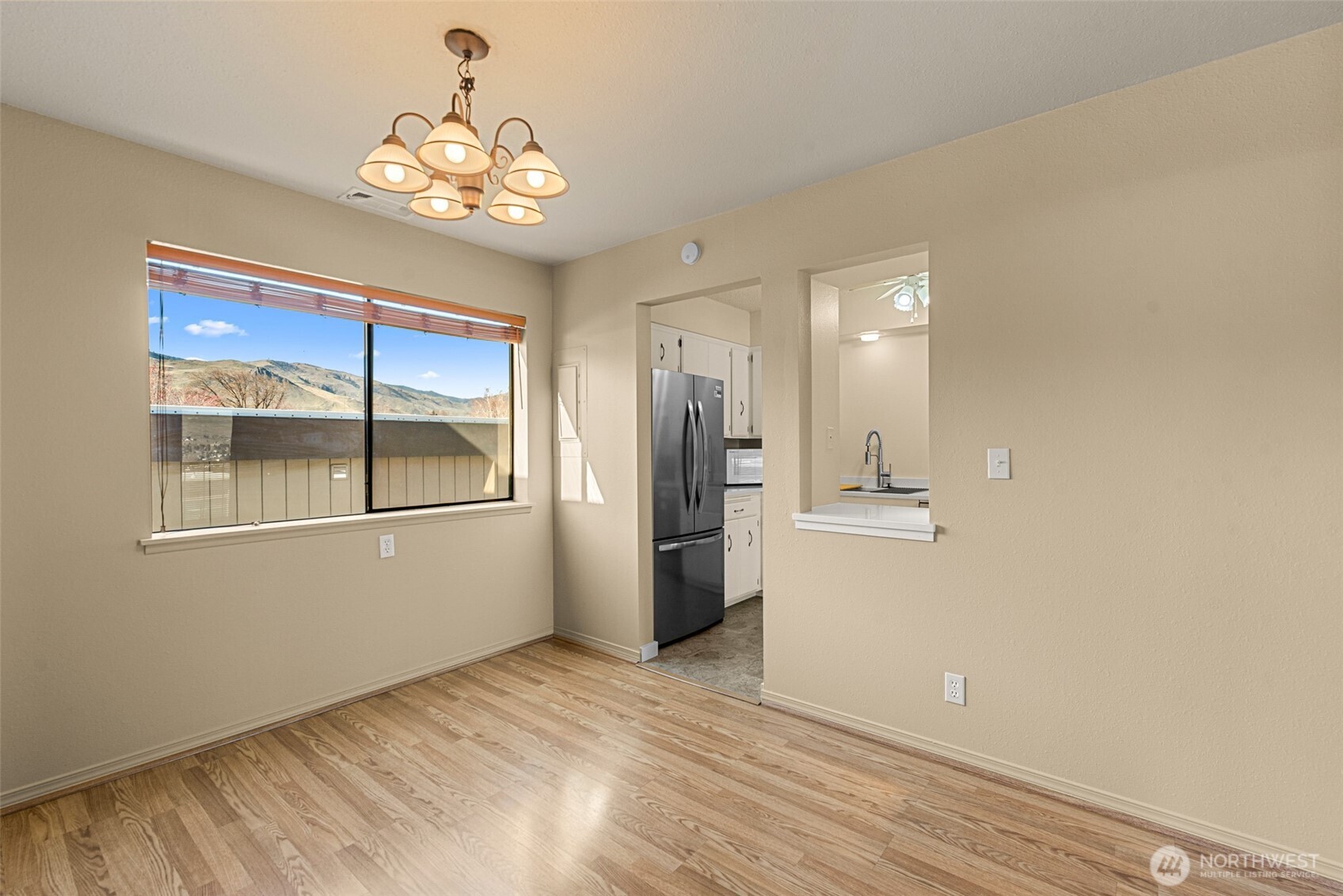407 Oregon Street, Unit 231 Wenatchee, WA 98801 - Photo 13 of 31 a view of a kitchen with a sink and refrigerator