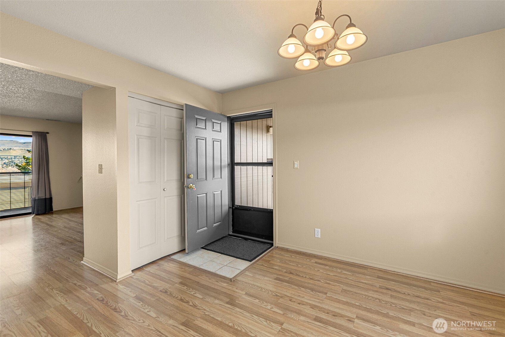 407 Oregon Street, Unit 231 Wenatchee, WA 98801 - Photo 14 of 31 a view of an empty room with window and wooden floor