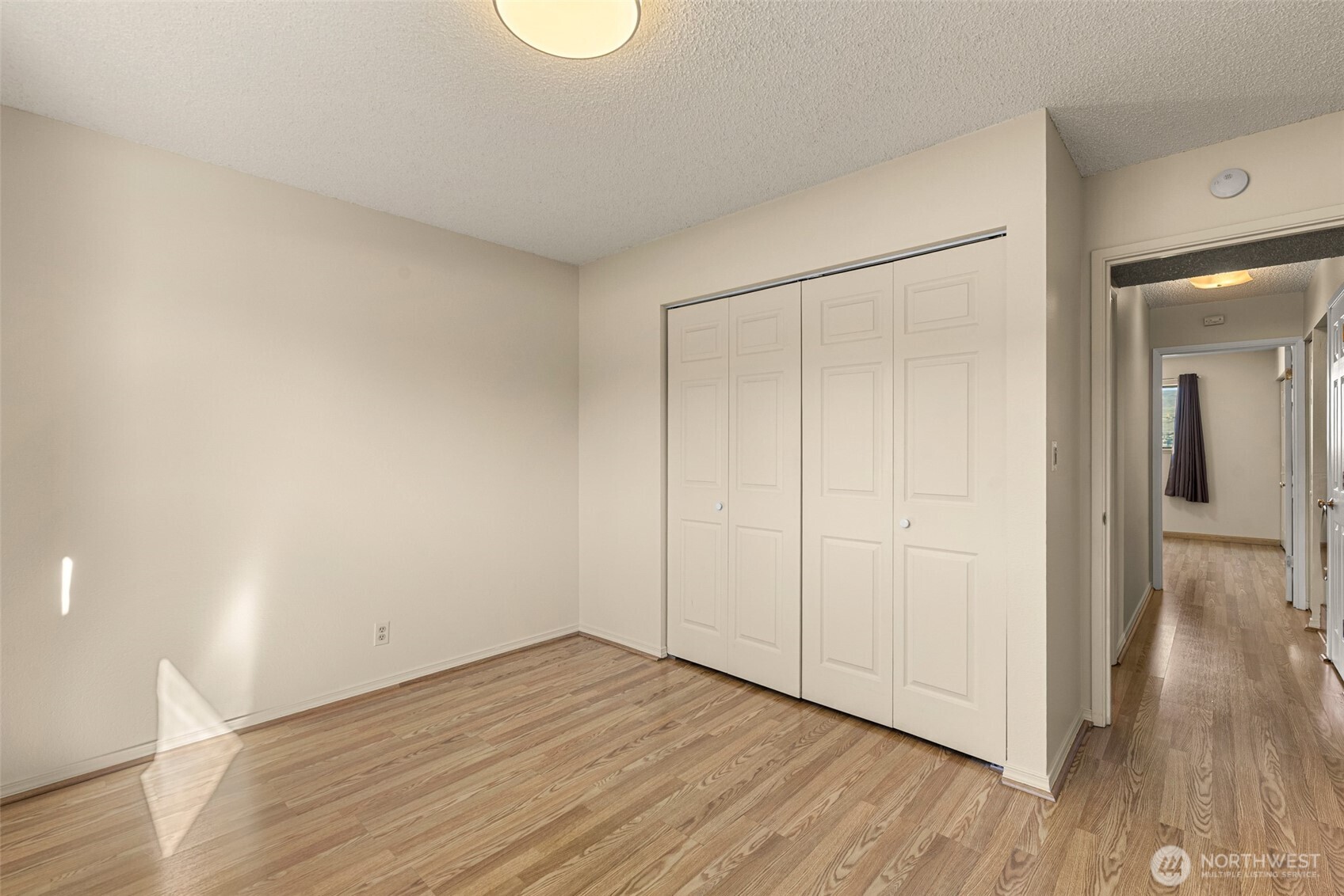407 Oregon Street, Unit 231 Wenatchee, WA 98801 - Photo 20 of 31 a view of an empty room and wooden floor