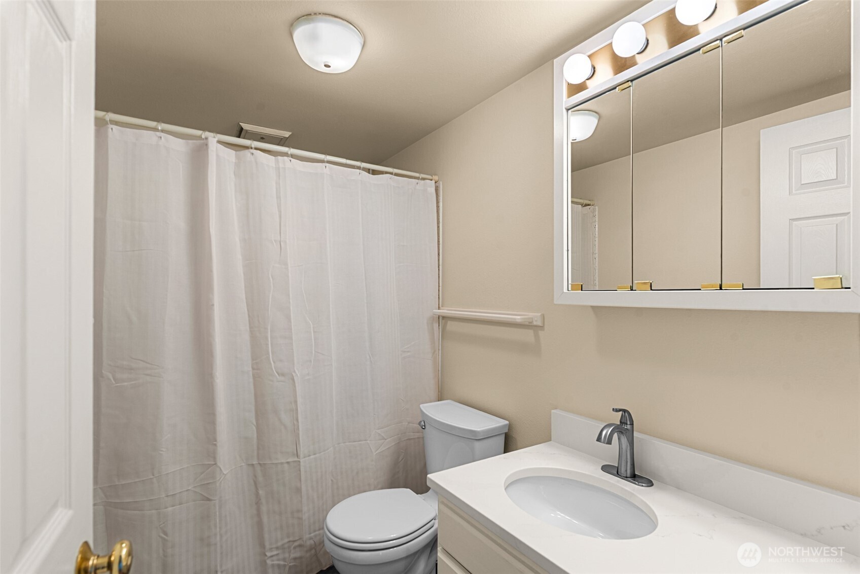 407 Oregon Street, Unit 231 Wenatchee, WA 98801 - Photo 21 of 31 a bathroom with a sink a toilet and shower