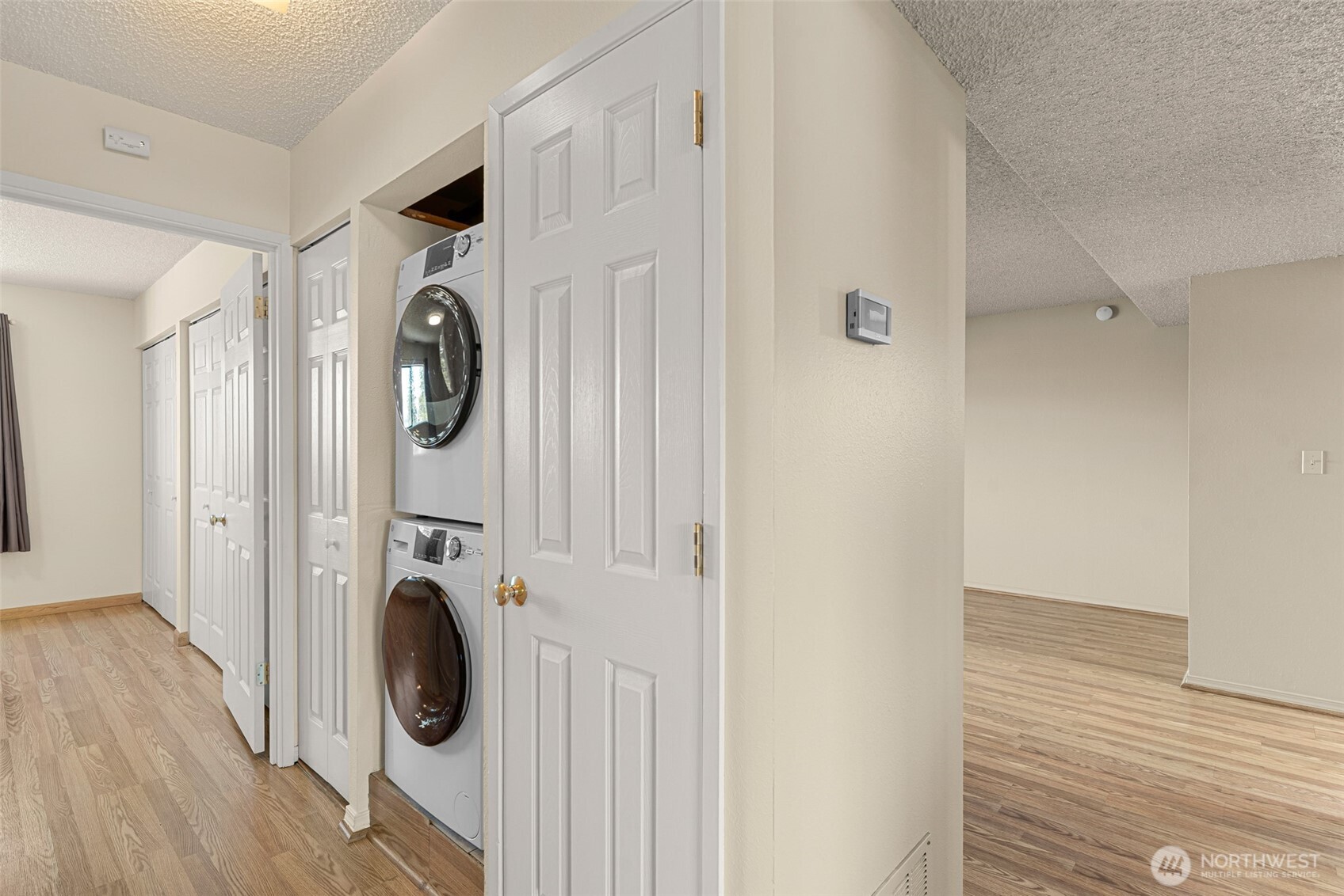 407 Oregon Street, Unit 231 Wenatchee, WA 98801 - Photo 22 of 31 a view of a hallway with washer and dryer