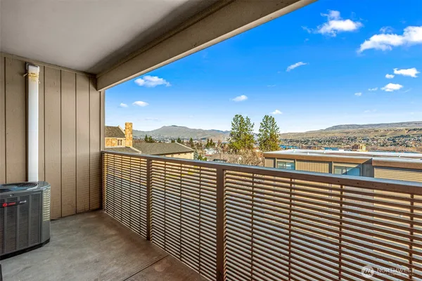 a view of balcony with furniture