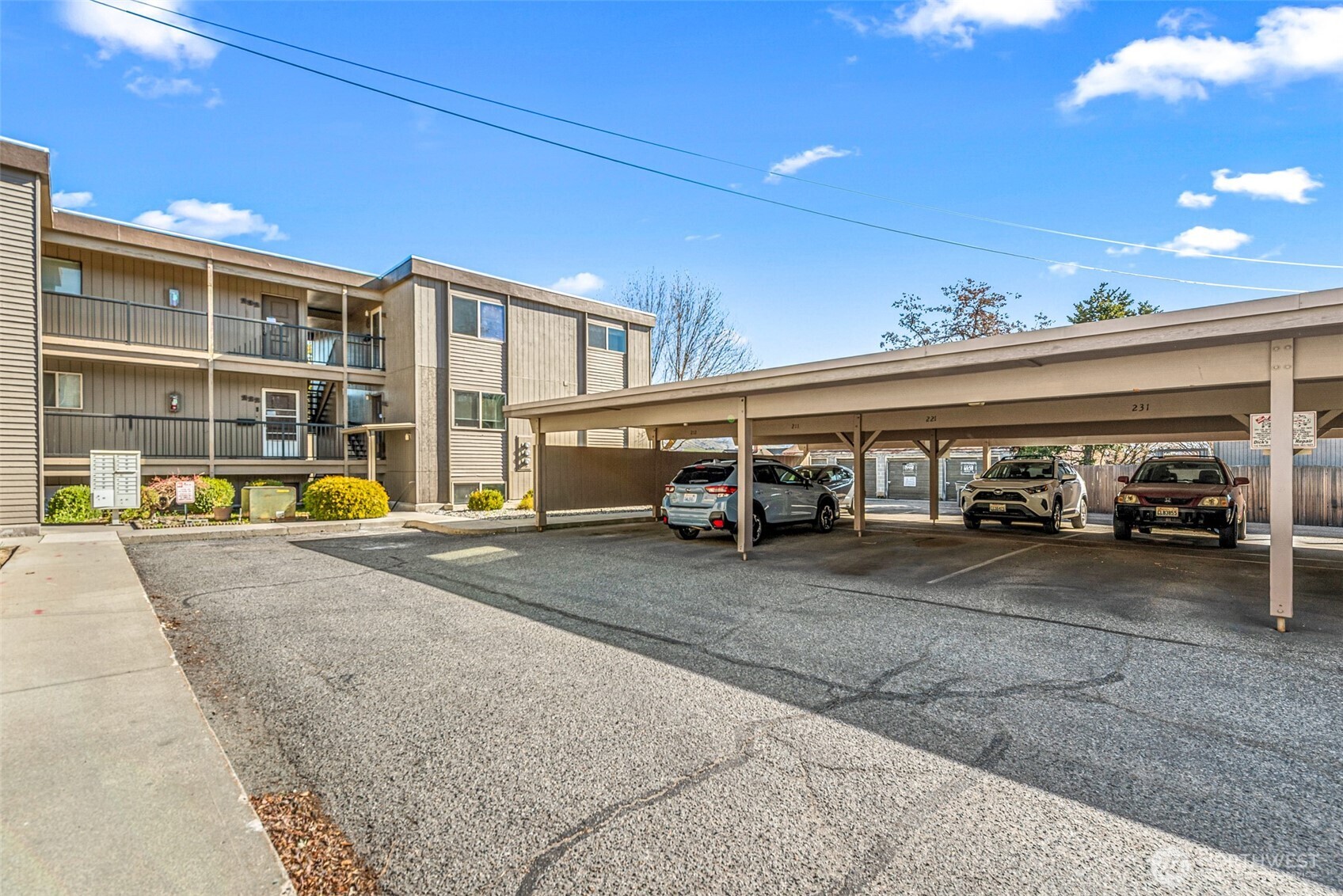 407 Oregon Street, Unit 231 Wenatchee, WA 98801 - Photo 31 of 31 a view of a building with car parked on the road